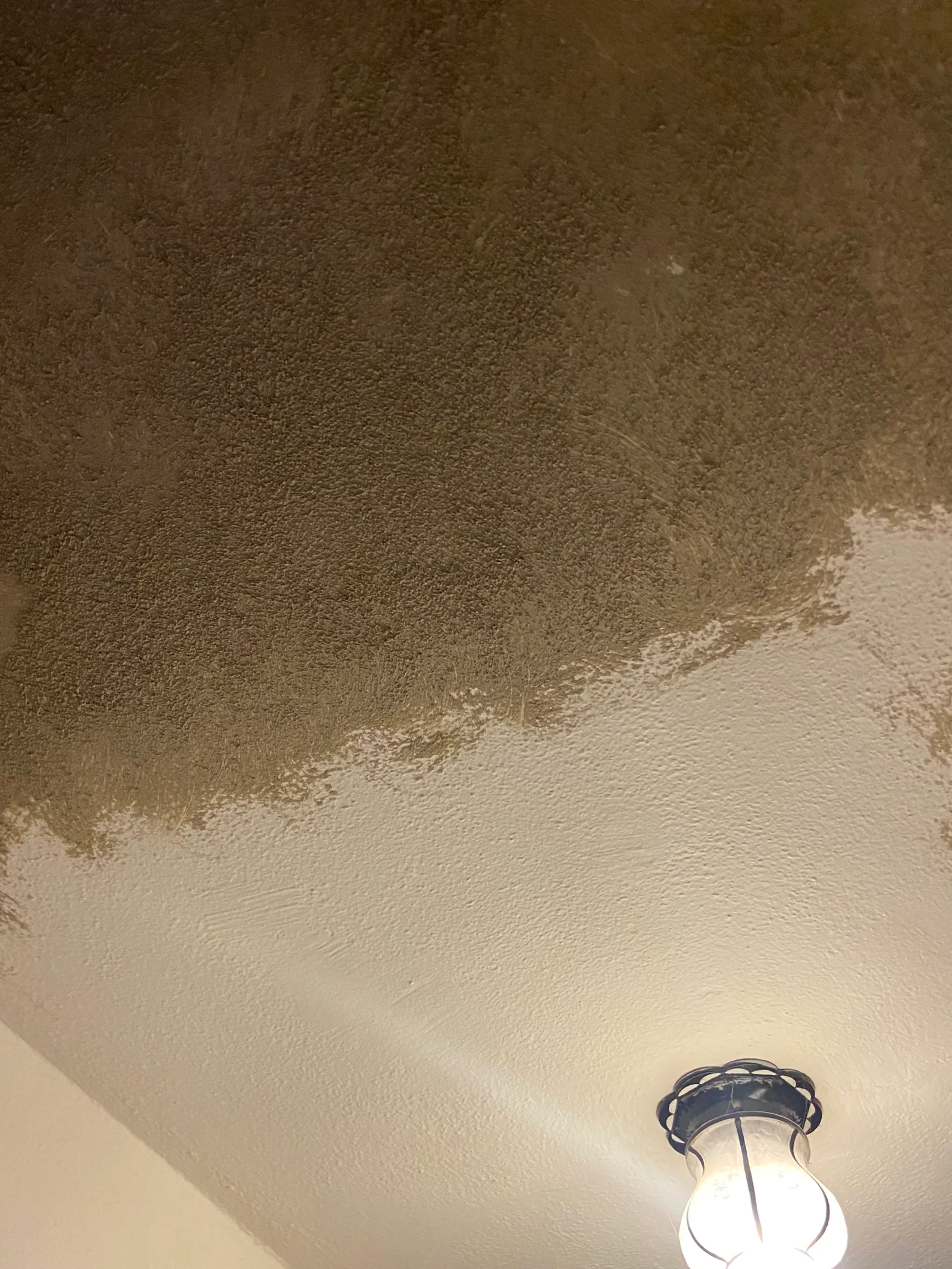 Finished drywall ceiling with smooth joint compound and neutral paint finish